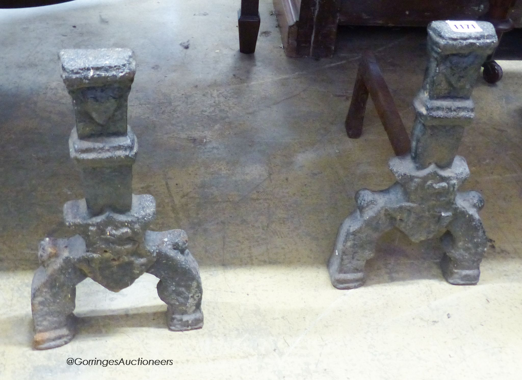 A pair of cast iron fire dogs. H-36cm.